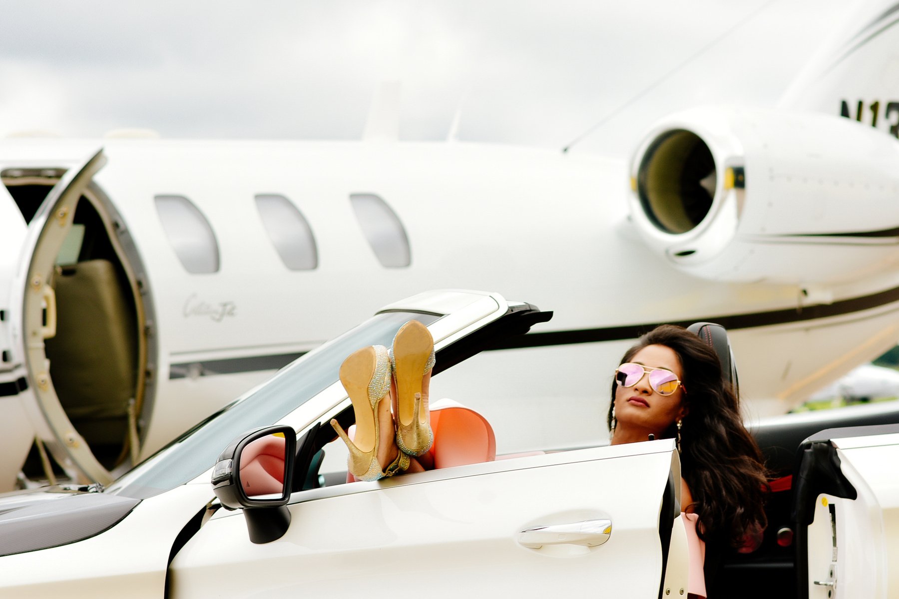 Woman In White Convertible Car