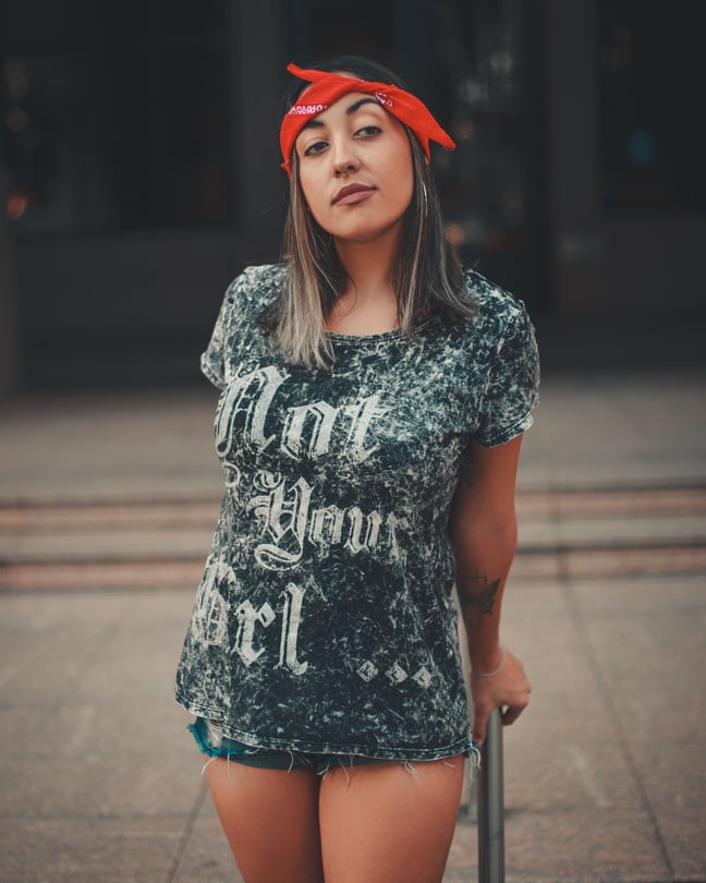 Photo of a Woman with a Red Headband Looking Away